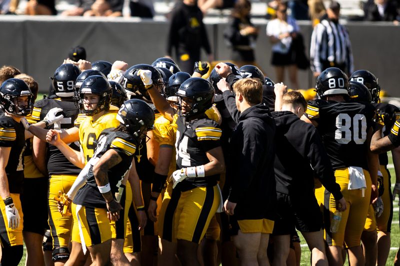 Apr 26, 2025; Iowa City, IA, USA; Iowa Hawkeyes players huddle up during a spring NCAA football open practice at Kinnick Stadium. Mandatory Credit: Joseph Cress/For the Register