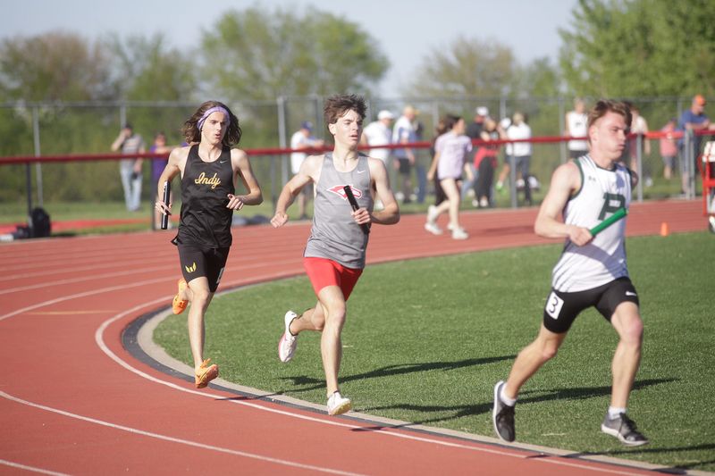A Dallas Center-Grimes runner competes in the 4x800 relay during the Little Hawkeye Conference meet on Thursday, May 8, 2025.