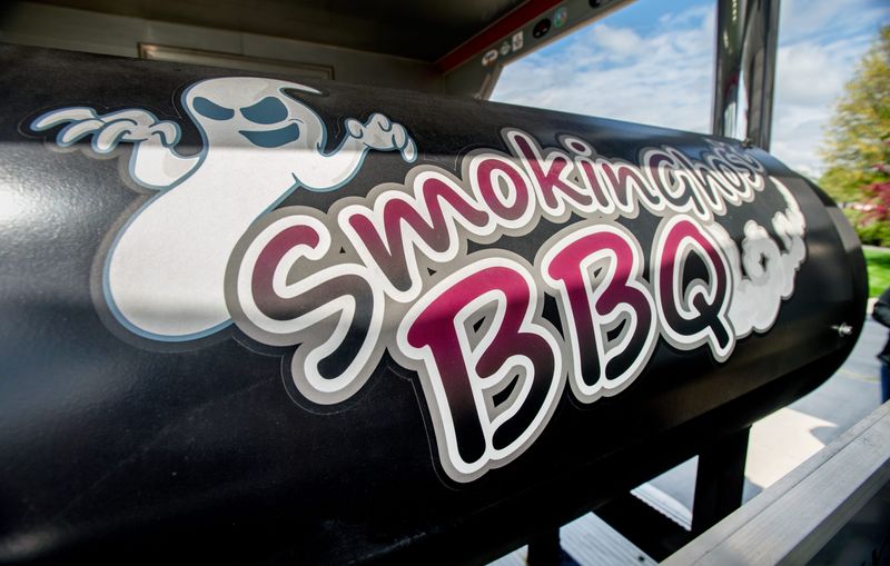 A custom-made logo inspired by the IVC Gray Ghost adorns the smoker on the front of Paul and Sarah Buob's mobile kitchen.