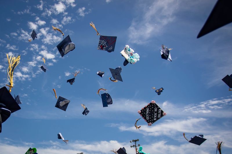 Caps fly as Marist Catholic High School graduates are recognized during the school's commencement ceremony on June 8, 2024 in Eugene, Oregon.
