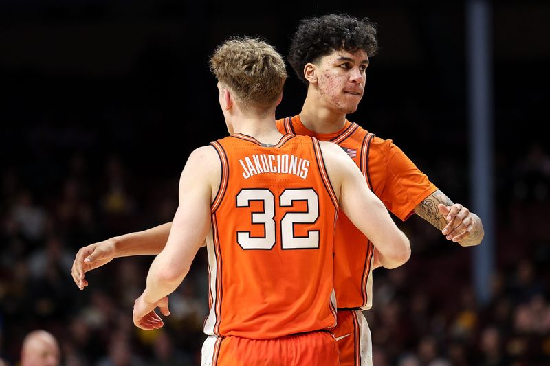 Feb 8, 2025; Minneapolis, Minnesota, USA; Illinois Fighting Illini forward Will Riley (7) and guard Kasparas Jakucionis (32) celebrate during the second half against the Minnesota Golden Gophers at Williams Arena. Mandatory Credit: Matt Krohn-Imagn Images