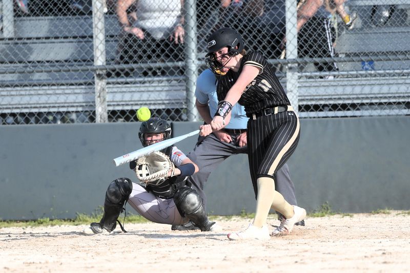 Sacred Heart-Griffin's Kenzie Wieland launches a solo home run against Rochester during a Central State Eight Conference softball game on Tuesday, April 22, 2025.