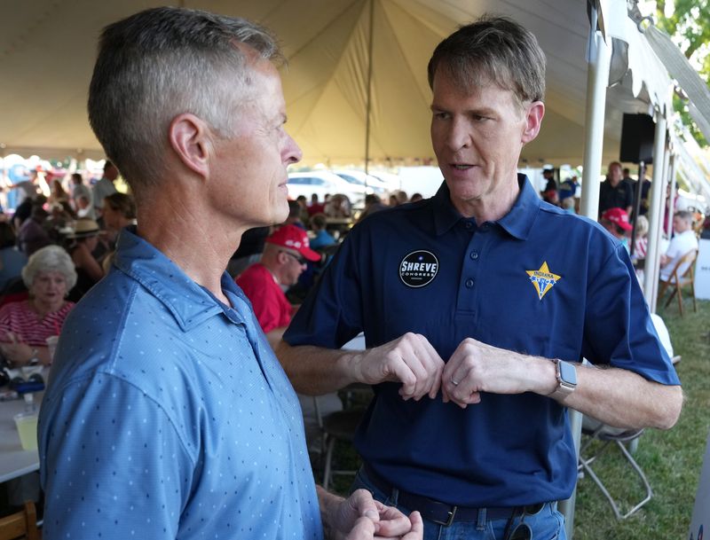 Jefferson Shreve, the Republican nominee for Indiana’s 6th Congressional District, right, speaks with Michael Smith on Sunday, Sept. 15, 2024, during the Johnson County Republican Party’s annual Chairman's GOP Rally and Cookout in Greenwood, Ind.