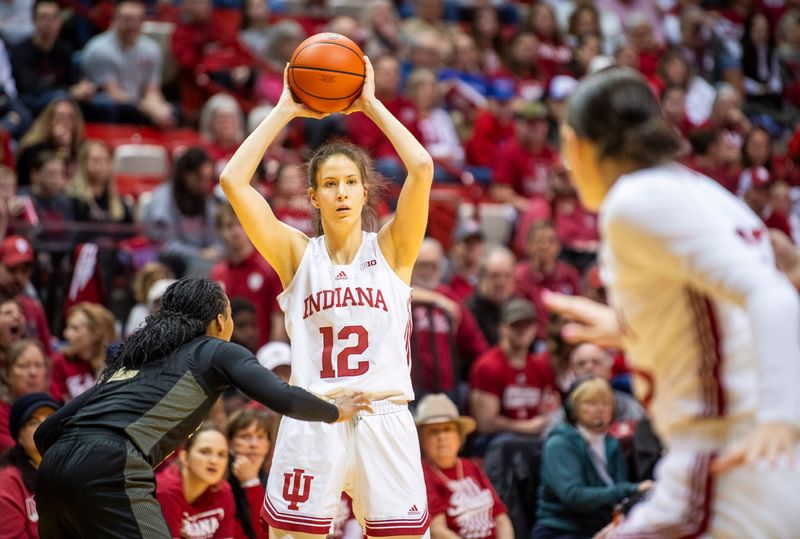 Indiana's Yarden Garzon (12) looks for Lilly Meister (52) during the Indiana versus Purdue women's basketball game at Simon Skjodt Assembly Hall on Saturday, Feb. 15, 2025.