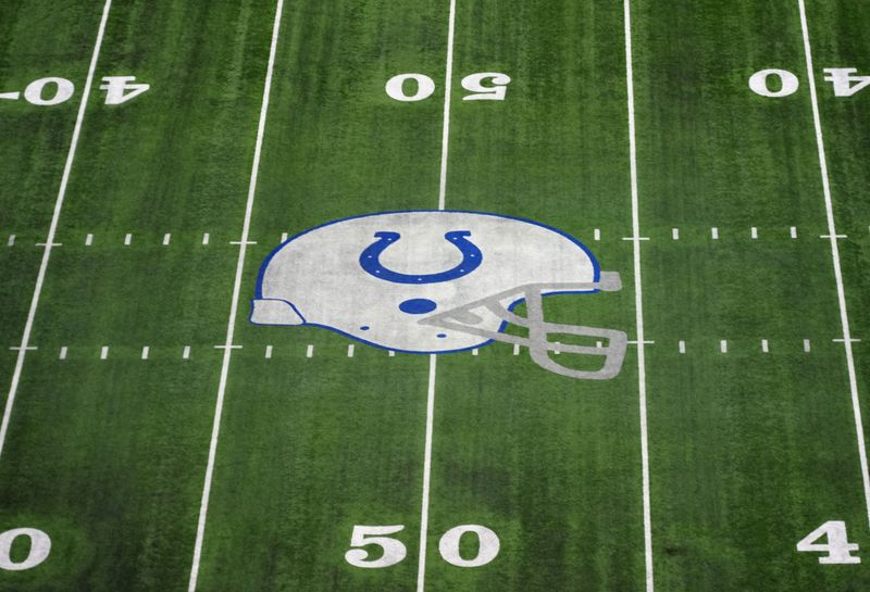 Feb 28, 2024; Indianapolis, IN, USA; The Indianapolis Colts helmet logo at midfield of Lucas Oil Stadium. Mandatory Credit: Kirby Lee-USA TODAY Sports