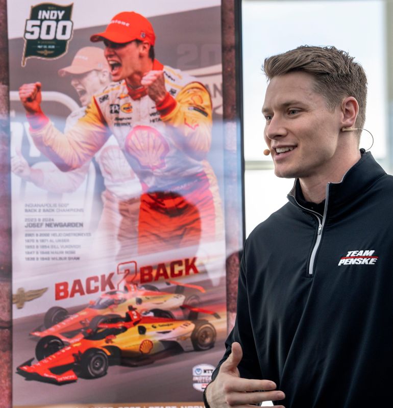 Josef Newgarden talks about the 2025 Indianapolis 500 ticket after it was unveiled Thursday, March 6, 2025 at the Indianapolis International Airport. The ticket shows two reactions to the win by Newgarden who won back-to-back races in 2023 and 2024, and two shots of his car crossing the finish line for those wins. It also pays homage to other two-time winners of the Indy 500.