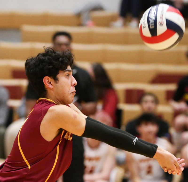 McCutcheon Mavericks libero Khelan Patel (1) hits the ball Wednesday, April 2, 2025, during the IHSAA boys volleyball match against the Lafayette Jeff Bronchos at McCutcheon High School in Lafayette, Ind.