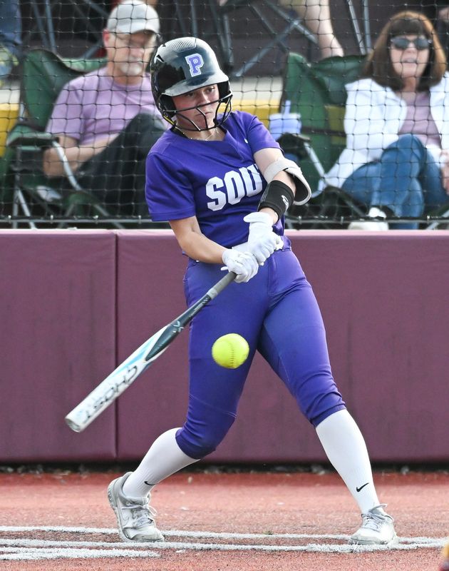 Bloomington South’s Evie Carpenter hits the ball during the softball game at North on Wednesday, April 30, 2025.
