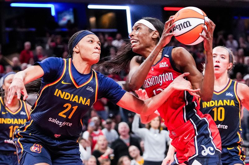 Indiana Fever Makayla Timpson (21) guards Washington Mystics Khadijiah Cave (13) on Saturday, May 3, 2025, during a preseason game between the Indiana Fever and the Washington Mystics at Gainbridge Fieldhouse in Indianapolis. The Indiana Fever defeated the Washington Mystics in overtime, 79-74.