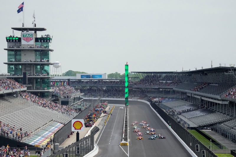 Drivers move down the front stretch as they take the green flag Saturday, May 10, 2025, during the Sonsio Grand Prix at Indianapolis Motor Speedway.