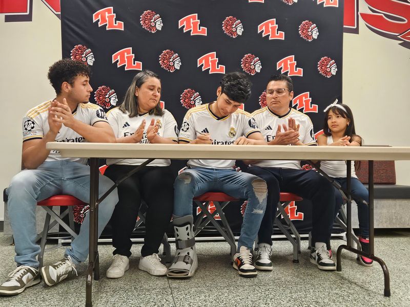 Twin Lakes senior Ricardo Amaya (center) signed a soccer scholarship to William Penn. He is  joined left to right by older brother Roniel Amaya, mother Romina Urbina, father Richard and younger sister Rania on Friday, May 9, 2025. Ethan Hanson/Journal & Courier