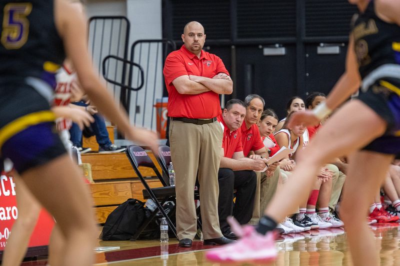 Then DeKalb girls basketball coach Noah Stuckey watches from the sidelines during a game from the 2022-23 season. He's been named the new coach at Edgewood.