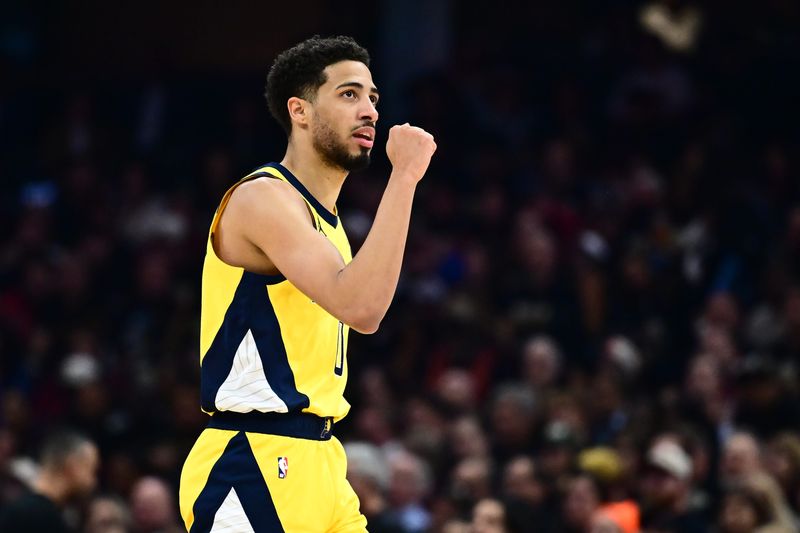 May 13, 2025; Cleveland, Ohio, USA; Indiana Pacers guard Tyrese Haliburton (0) celebrates after hitting a three point basket during the first half against the Cleveland Cavaliers in game five of the second round for the 2025 NBA Playoffs at Rocket Arena. Mandatory Credit: Ken Blaze-Imagn Images