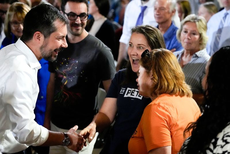 Former U.S. Secretary of Transportation Pete Buttigieg shakes hands after a town hall hosted by VoteVets May 13, 2025 in Cedar Rapids, Iowa.