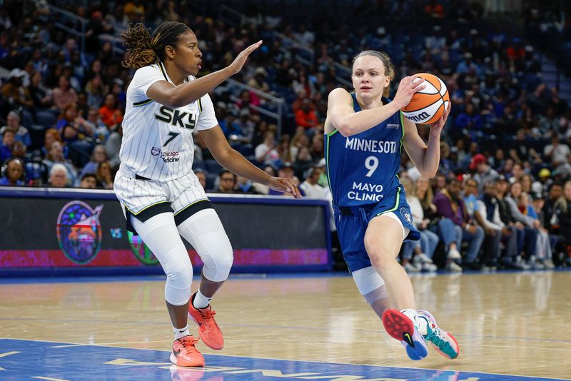 Minnesota Lynx guard Grace Berger drives to the basket against Chicago Sky guard Ariel Atkins during the first half of a WNBA preseason game May 6 at Wintrust Arena. Mandatory