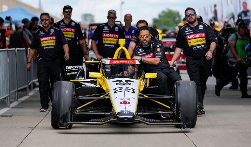 Andretti Global with Curb-Agajanian driver Colton Herta (26) crew walks the car out to the track Saturday, May 17, 2025, during qualifying for the 109th running of the Indianapolis 500 at Indianapolis Motor Speedway.