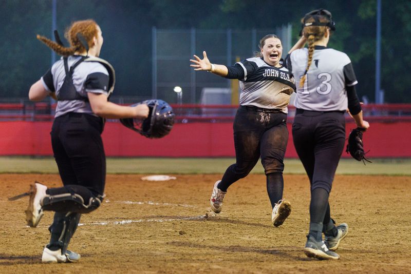 John Glenn's Payton Thomas (18) runs up to celebrate with McKenzie Timm (13) after winning the IHSAA 3A Sectional softball championship game 8-5 against Saint Joseph at Centennial Park on Wednesday, May 28, 2025, in Plymouth.