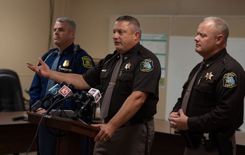 Flanked by MSP Unit Commander Lt. Brian Oleksyk, left, and Clinton County Undersheriff Mike Gute, Clinton County Sheriff Sean Dush updates members of the press, Tuesday, Oct. 10, 2023, during a news conference at the Watertown Township Hall about the search for a missing Clinton County toddler. Shortly after, the two-year-old's body was recovered by dive teams in the Looking Glass River.