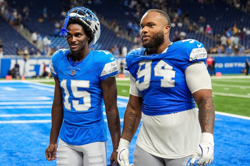 Detroit Lions cornerback Ennis Rakestraw Jr. (15), left, talks to defensive tackle Mekhi Wingo (94) was they walk off the field after 24-17 win over Pittsburgh Steelers at a preseason game at Ford Field in Detroit on Saturday, August 24, 2024.