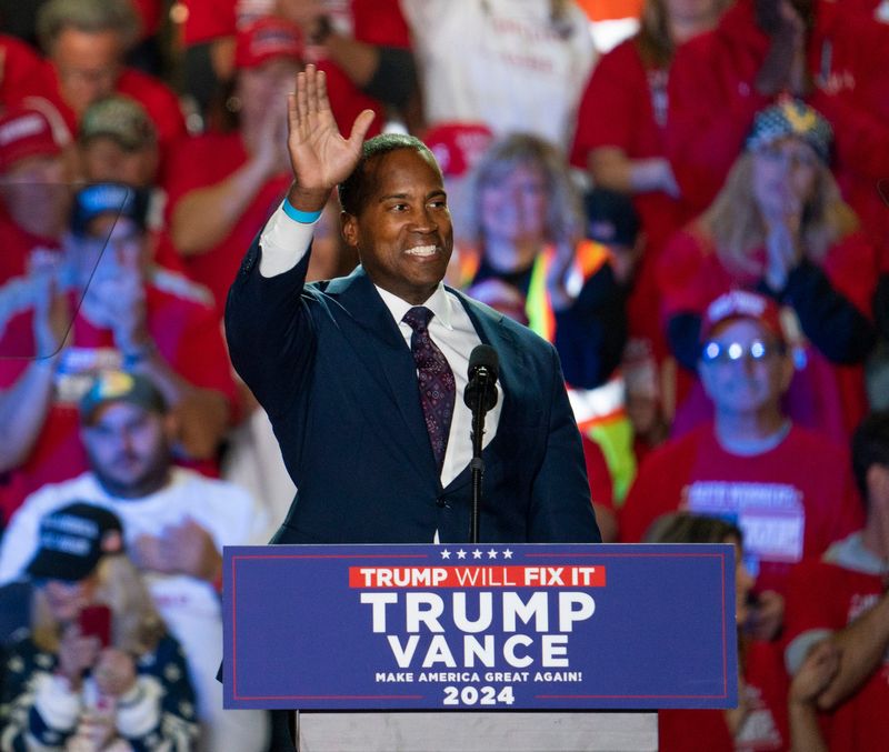 Republican U.S. Rep. John James of Shelby Township speaks before Donald Trump takes the stage at Macomb Community College on Friday, Nov. 1, 2024.