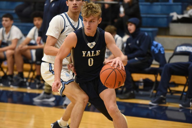 Yale's Jackson Kohler drives baseline during a game against Richmond at Richmond High School on Thursday, Dec. 12, 2024.