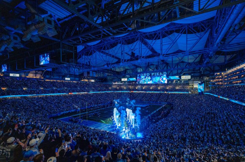 The Detroit Lions take the field ahead of their game against the Washington Commanders at Ford Field in Detroit on Saturday, Jan. 18, 2025.