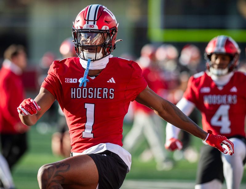 Indiana's Donaven McCulley (1) does stretching exercises during Indiana football spring practice at Memorial Stadium on Thursday, March 21, 2024. Credit: Rich Janzaruk/Herald-Times-USA TODAY NETWORK