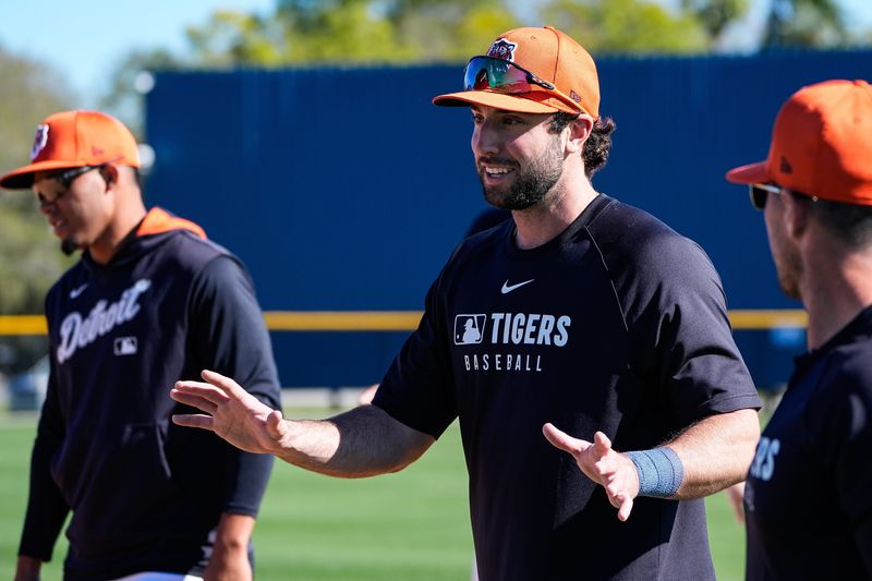 Detroit Tigers outfielder Matt Vierling, center, talks to teammates during spring training at TigerTown in Lakeland, Fla. on Monday, Feb. 17, 2025.