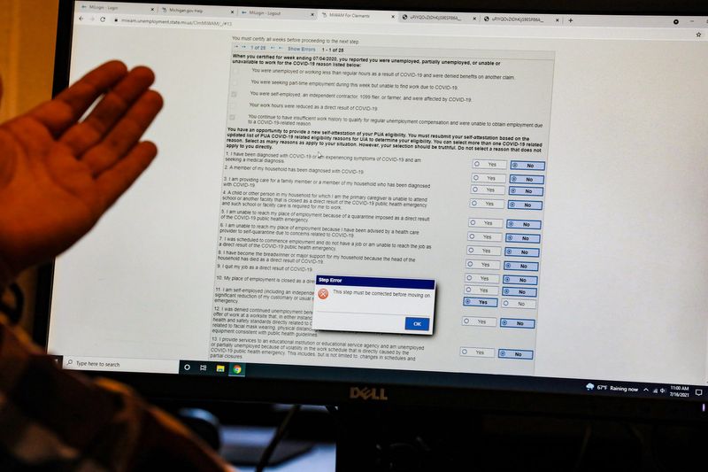 After the state's Unemployment Insurance Agency recently asked hundreds of thousands of claimants to re-certify for benefits, Tony Paris of Sugar Law Center has been inundated with calls from claimants to help them file on the Michigan Web Account Manager for unemployment at his office at Cass Commons in Detroit on July 16, 2021.