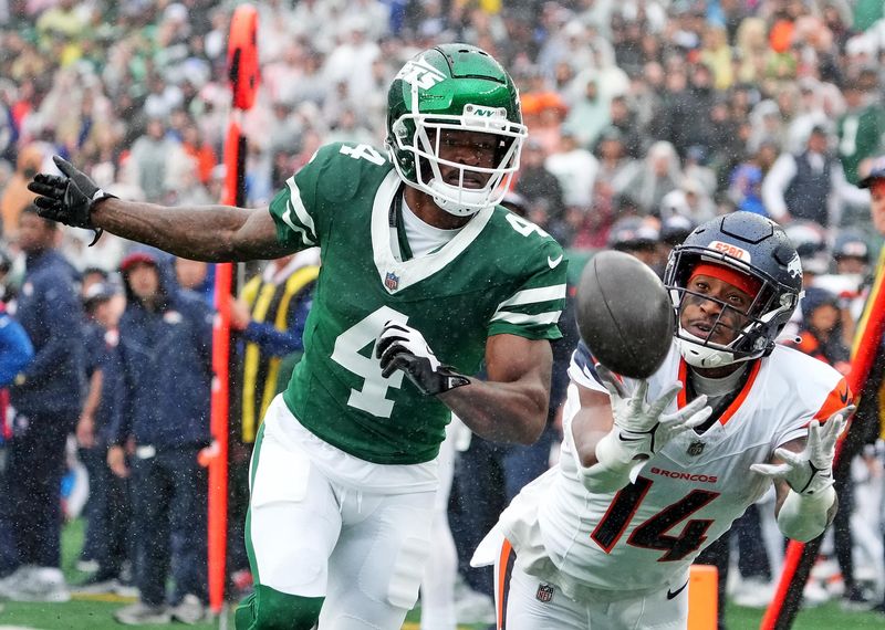 Denver Broncos receiver Courtland Sutton has a pass knocked away by New York Jets cornerback D.J. Reed during the first quarter at MetLife Stadium, Sept. 29, 2024 in East Rutherford, N.J.