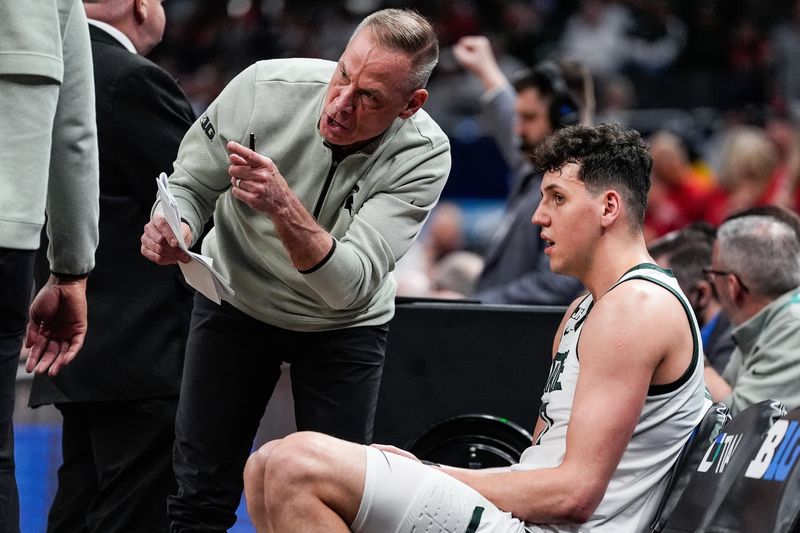 Michigan State assistant coach Doug Wojcik talks to center Szymon Zapala (10) at a timeout against Wisconsin during the first half of Big Ten Tournament semifinal at Gainbridge Fieldhouse in Indianapolis, Ind. on Saturday, March 15, 2025.
