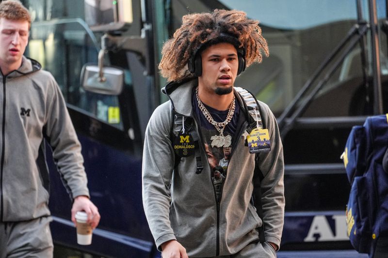 Michigan Wolverines guard Tre Donaldson (3) arrives at Ball Arena in Denver, Colorado for the first round of the NCAA tournament against UC San Diego.