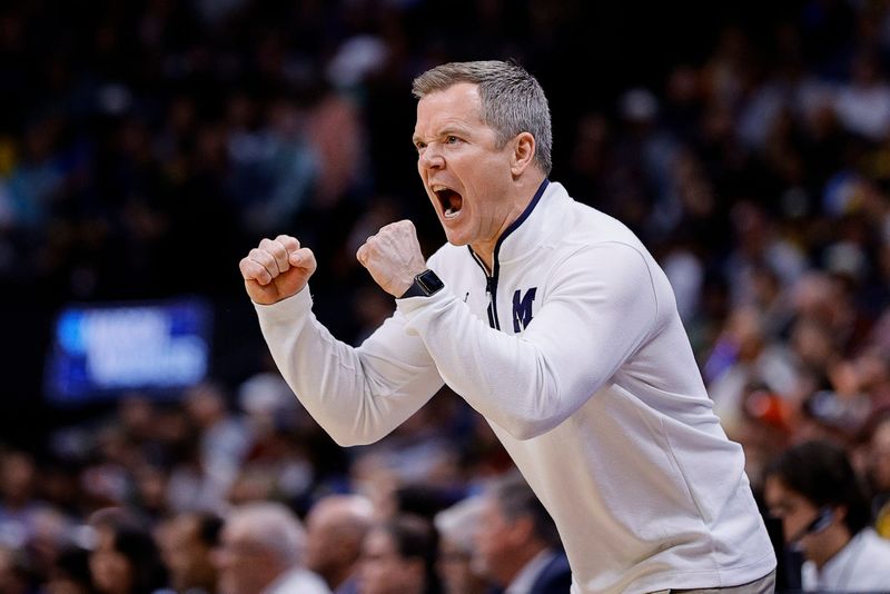 March 20, 2025; Denver, CO, USA; Michigan Wolverines head coach Dusty May reacts during the first half against the UC San Diego Tritons at Ball Arena. Mandatory Credit: Isaiah J. Downing-Imagn Images