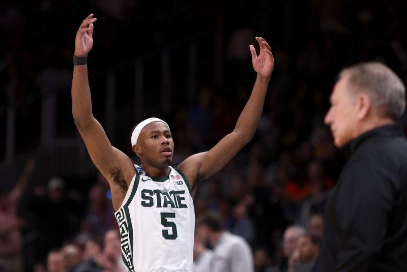 Mar 28, 2025; Atlanta, GA, USA; Michigan State Spartans guard Tre Holloman (5) reacts after a play in the second half of a South Regional semifinal of the 2025 NCAA tournament against the Mississippi Rebels at State Farm Arena. Mandatory Credit: Brett Davis-Imagn Images