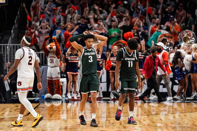 Michigan State guard Jaden Akins (3) and guard Jase Richardson (11) walk off the court after 70-64 loss to Auburn at the Elite Eight round of NCAA tournament at State Farm Arena in Atlanta, Ga. on Sunday, March 30, 2025.