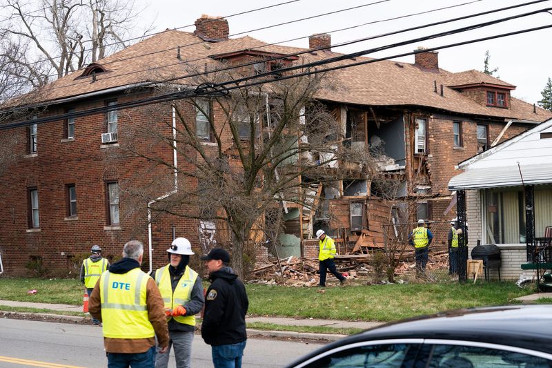 Personnel from DTE look into what may have caused an early morning explosion on the 13000 block of Littlefield in Detroit on Monday, March 31, 2025.
