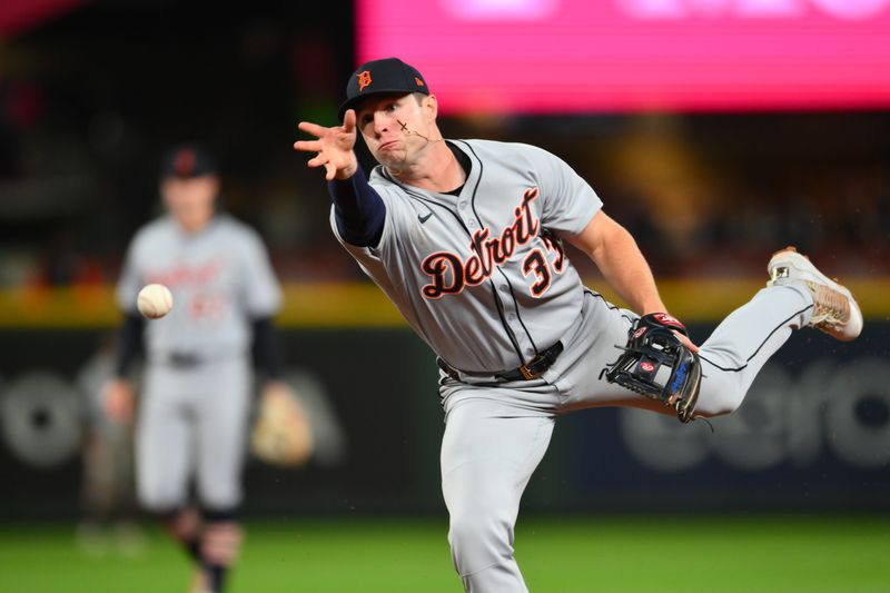 Detroit Tigers second baseman Colt Keith (33) throws the ball to first base for a force out on Seattle Mariners first baseman Luke Raley (20) during the seventh inning at T-Mobile Park on Tuesday, April 1, 2025.
