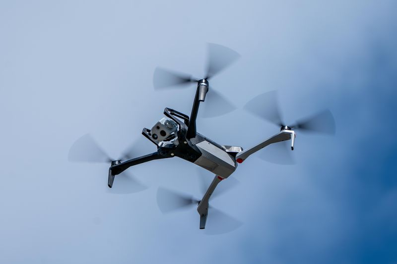 A police drone flies above the crowd during the inaugural Preschool Story Time Police Day event at the Society of the Four Arts April 3, 2025.