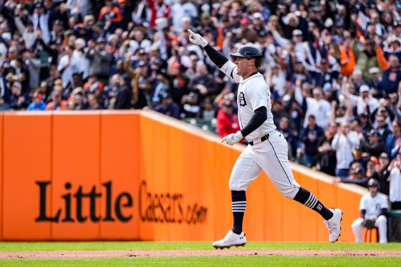 Detroit Tigers left fielder Kerry Carpenter celebrates his first home run of the season against the Chicago White Sox during the first inning of Opening Day at Comerica Park in Detroit on Friday, April 4, 2025.