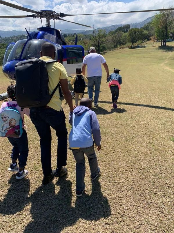 Children being rescued for security reasons in Port-au-Prince are helped by HERO Rescue, which flies people to safety throughout Haiti.