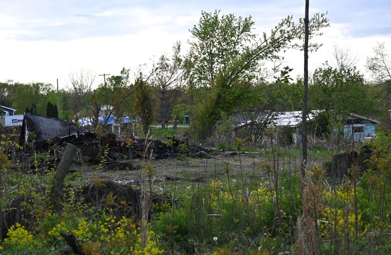 Debris and downed trees still litter Arny Road a year after two EF-2 tornadoes struck on May 7, 2024 in Sherwood township.