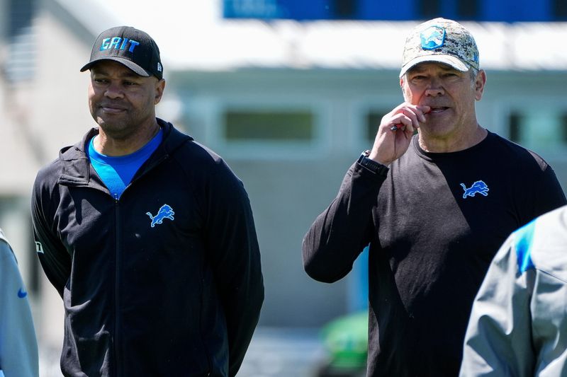 Detroit Lions passing game coordinator David Shaw, left, and quarterbacks coach Mark Brunell walk off the field after practice during rookie mini camp at Meijer Performance Center in Allen Park on Friday, May 9, 2025.