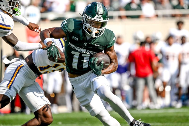 Michigan State's Aziah Johnson breaks tackles on his way to a touchdown against Prairie View A&M during the first quarter on Saturday, Sept. 14, 2024, at Spartan Stadium in East Lansing.