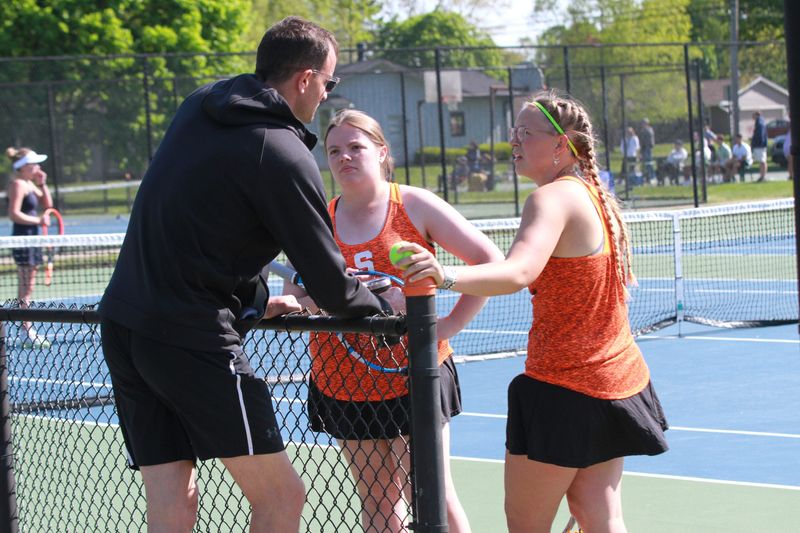 Sturgis coach Andy Phillips chats with first doubles team of Arianna Terwedo and Bella Currier in between games on Saturday.