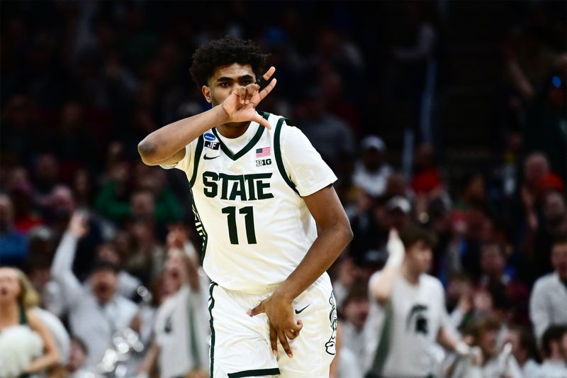 Mar 21, 2025; Cleveland, OH, USA; Michigan State Spartans guard Jase Richardson (11) reacts in the second half against the Bryant University Bulldogs during the NCAA Tournament First Round at Rocket Mortgage Fieldhouse. Mandatory Credit: Ken Blaze-Imagn Images