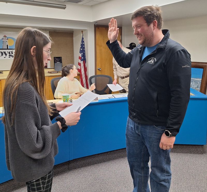 Adam Bedwin takes the oath of office from Cheboygan City Clerk Alyssa Singles on Tuesday, May 13, 2025. He was appointed by city council to serve in place of Sierra Oliver until a special election is held in November.