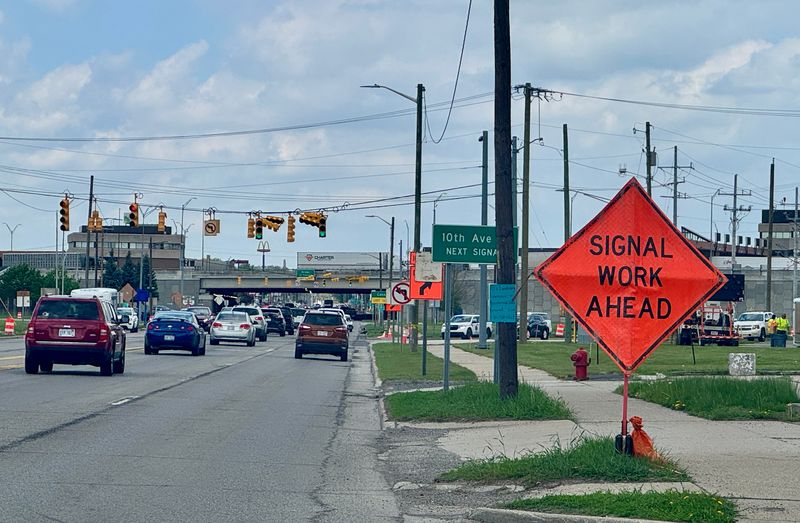 Signal work ahead alerts traffic along Pine Grove Avenue.