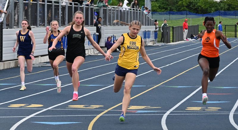Erie Mason's Giuliana Nastale wins the 100 meters with Adela Illes of St. Mary Catholic Central close behind at the Division 3 Regional at Adrian Madison on Saturday, May 17, 2025.