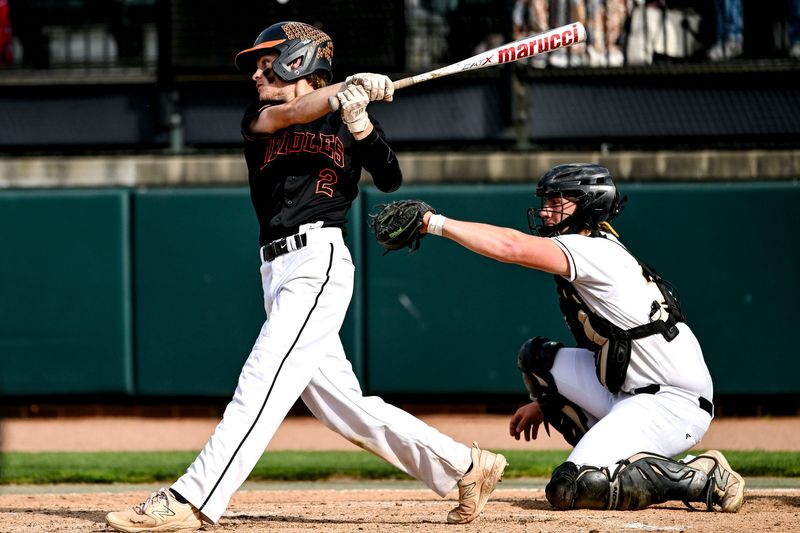 Charlotte's Ty Bowzer gets a hit against Holt in the third inning on Monday, May 19, 2025, during the Diamond Classic game at McLane Stadium in East Lansing.