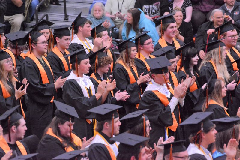 Cheboygan High School 2025 graduates applaud during the final stages of their commencement ceremony at the Cheboygan High School gymnasium on Friday.